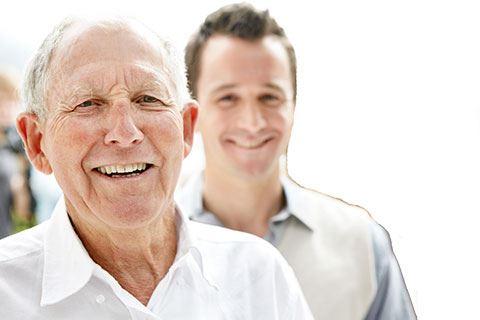 dad and son smiling 